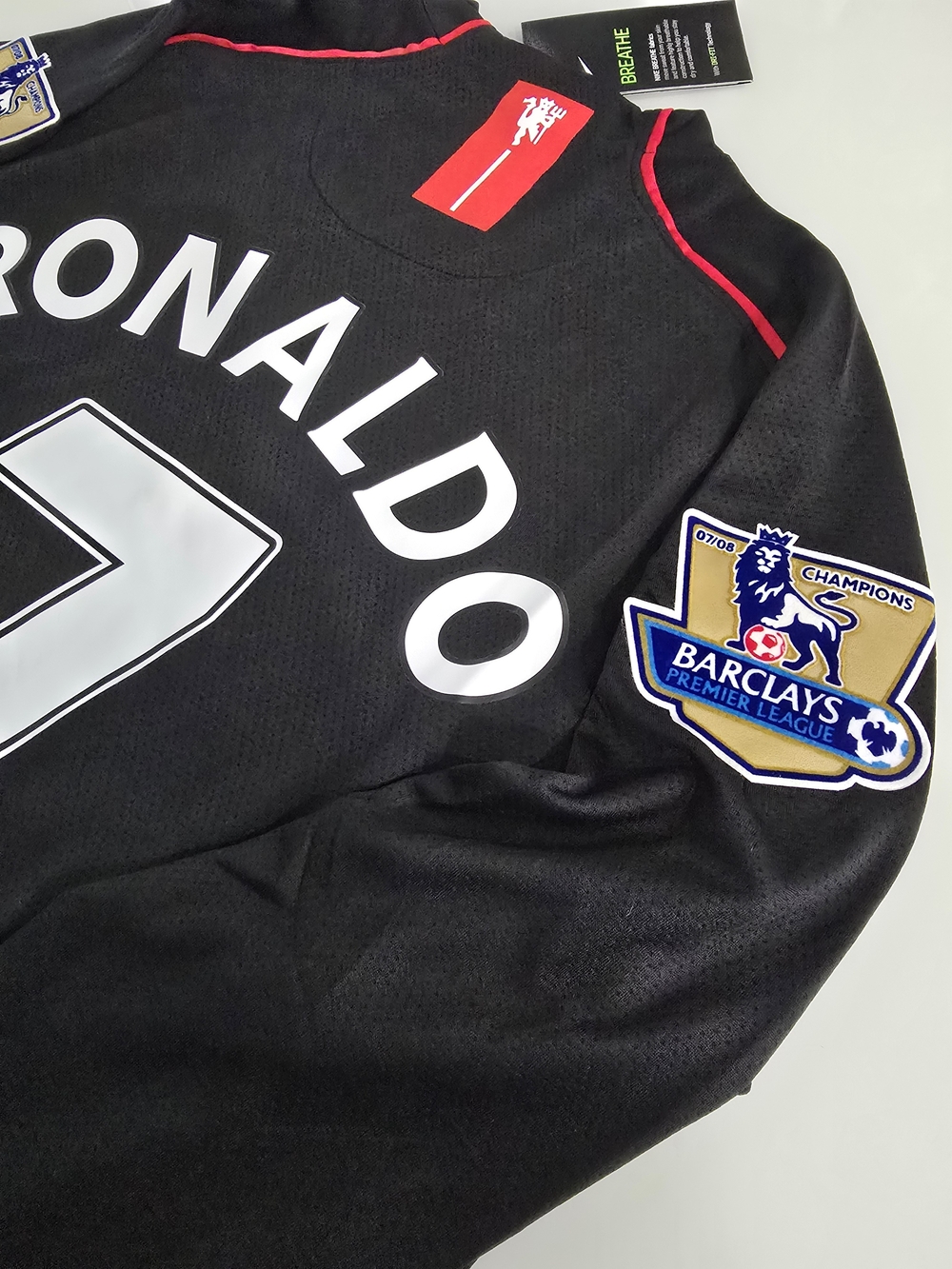 Black Ronaldo Football Jersey with White Number and Red Accents